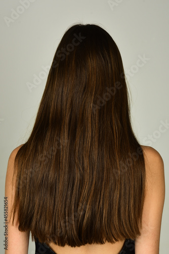 Health long hair concept. Hair treatment. Woman hair back.