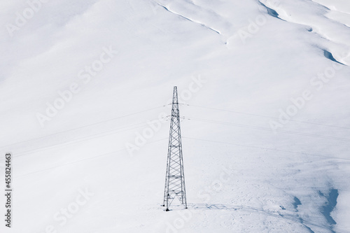 Power line on the snowfield photo