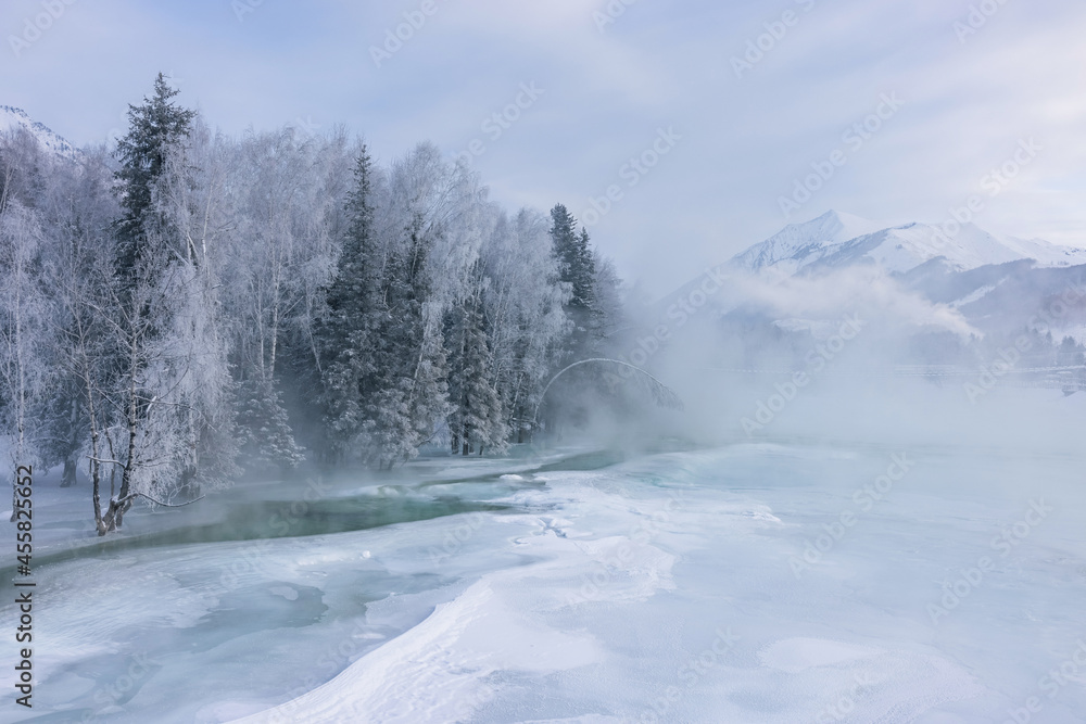 Winter landscape with river, trees and snow mountain. Winter landscape with river, trees and snow mountain.