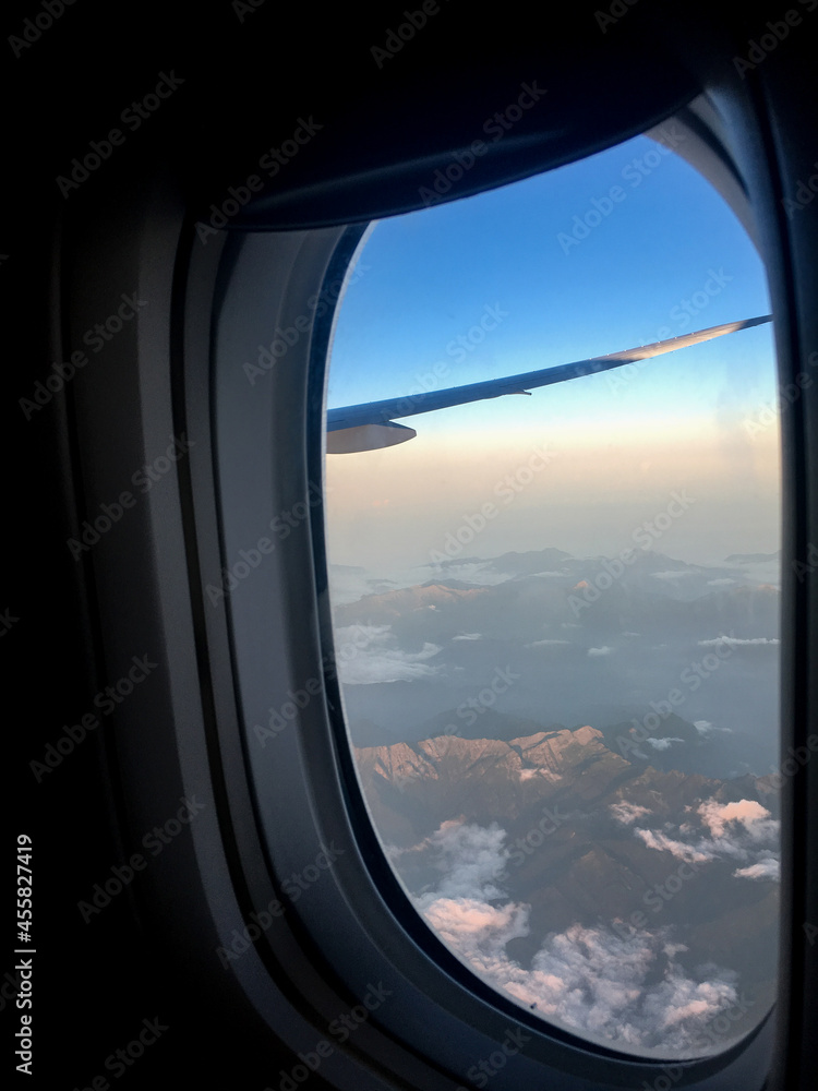 Window view of sky outside in an airplane. Window view of sky outside in an airplane.