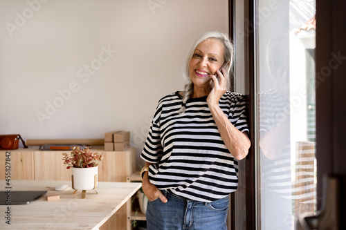 Mature woman calling by phone photo