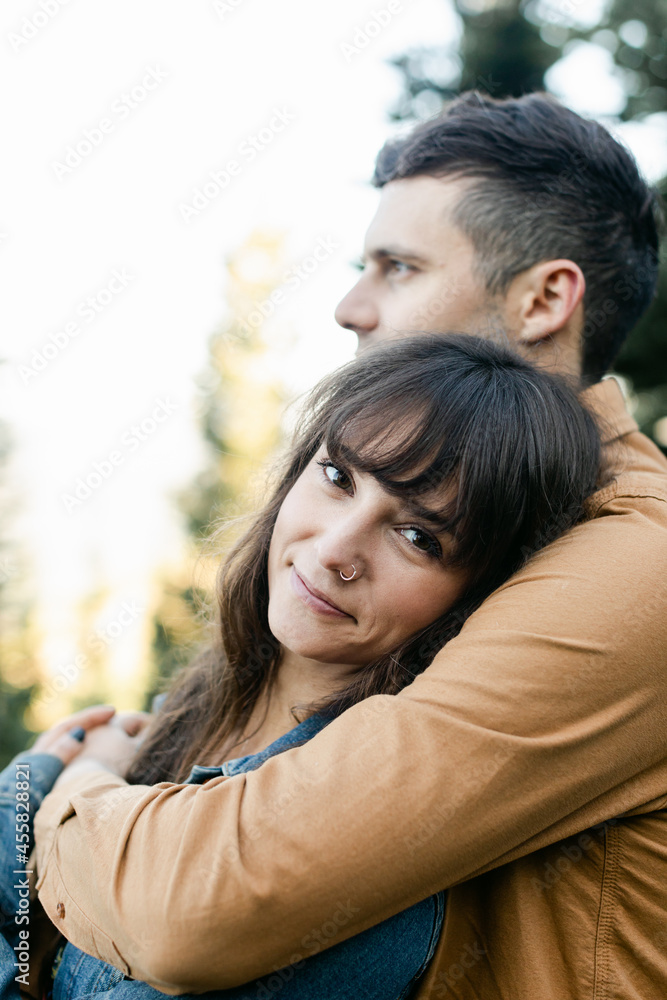 A Cute Couple Hugs while in the Woods A Cute Couple Hugs while in the Woods
