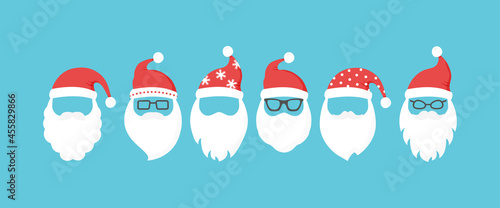 Santa Claus head, Christmas face vector icon, cute winter character with breard and hat. Holiday illustration on blue background photo