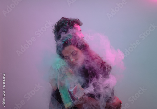 Cinematic hug portrait inside smoke cloud