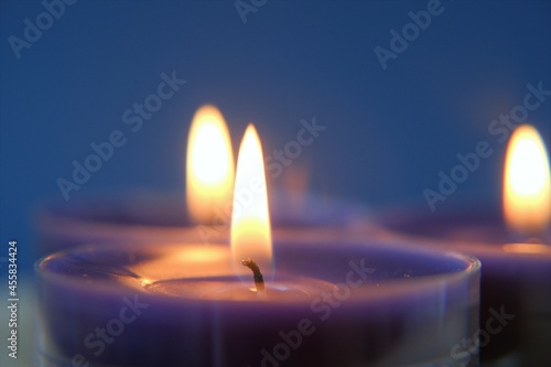 Wallpaper Mural Burning candles.Religion symbol. Candles background.Blue candles on dark blue background.  Torontodigital.ca