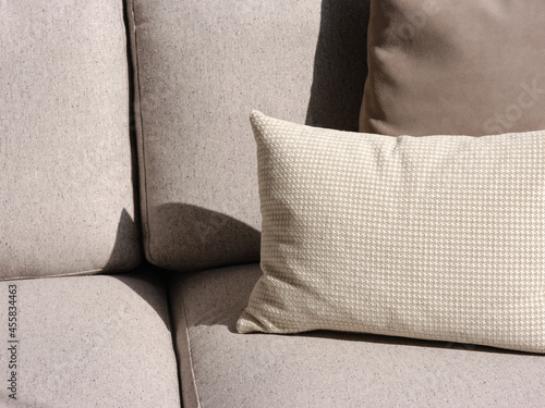 Beige cushions on couch. photo