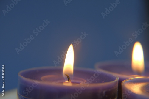  Candles background.Blue candles on dark blue background. 