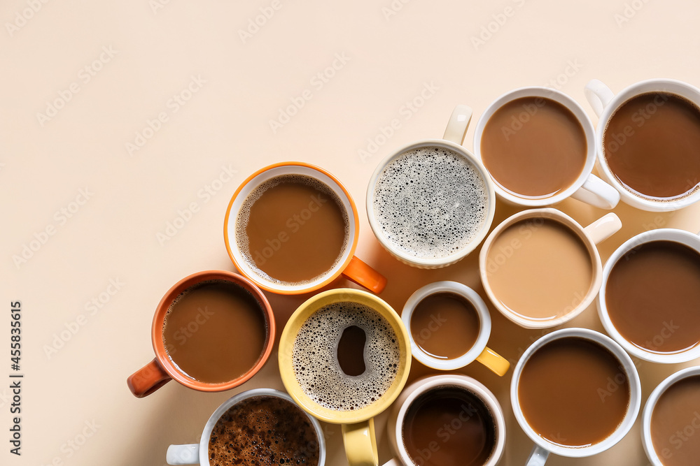 Cups of tasty coffee on light background