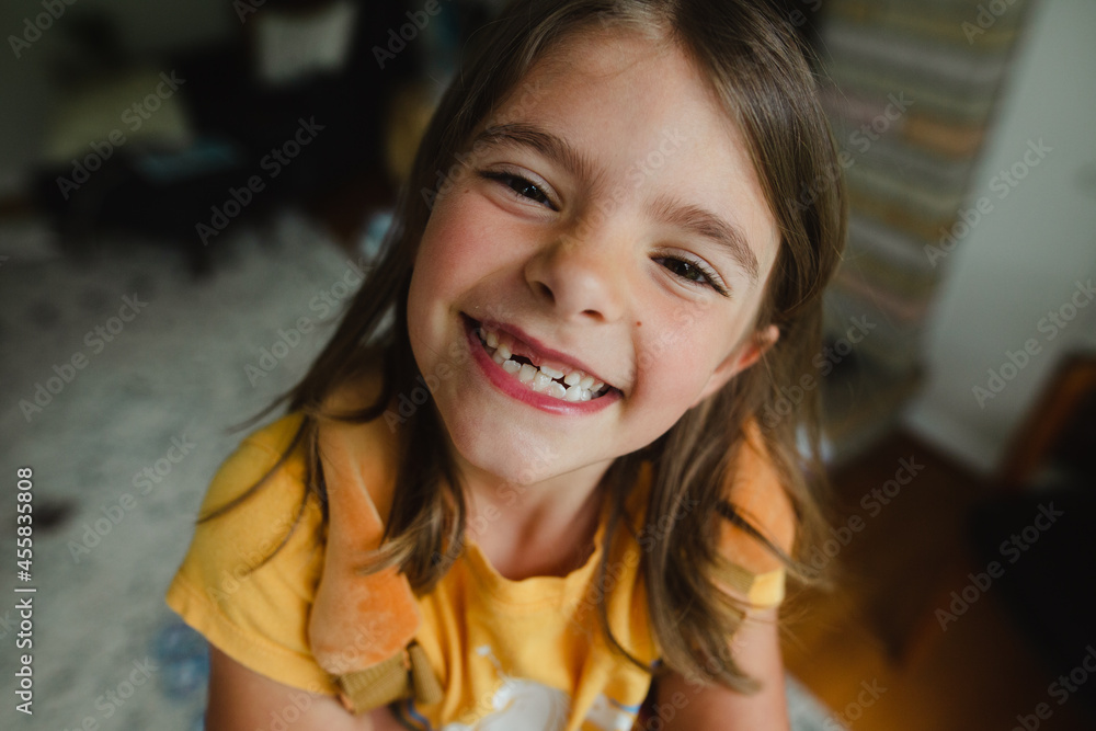 Happy child without tooth looking at camera and cheerfully smiling Happy child without tooth looking at camera and cheerfully smiling