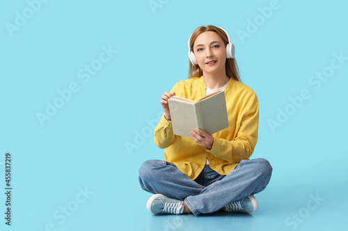 Mature woman with headphone...