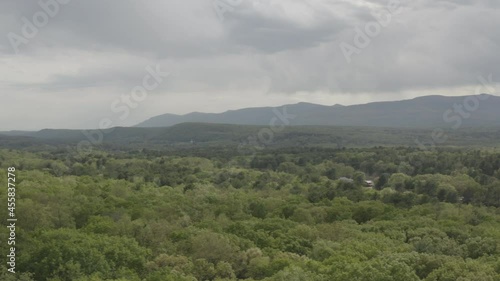 Aerial dolly pan of mountains and trees