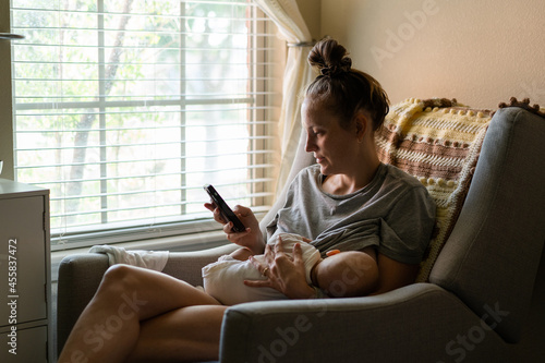 Multitasking Mother Breastfeeding