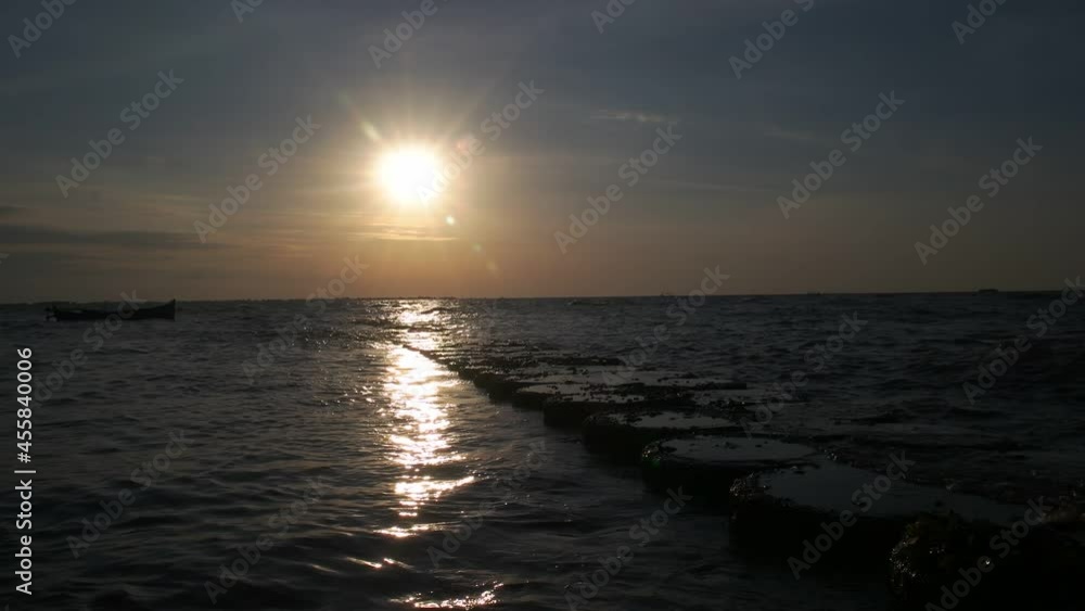 time lapse afternoon on the beach with the sun going down time lapse afternoon on the beach with the sun going down