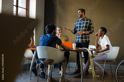 Wallpaper Mural Creative business people working at tables in sunny office Torontodigital.ca
