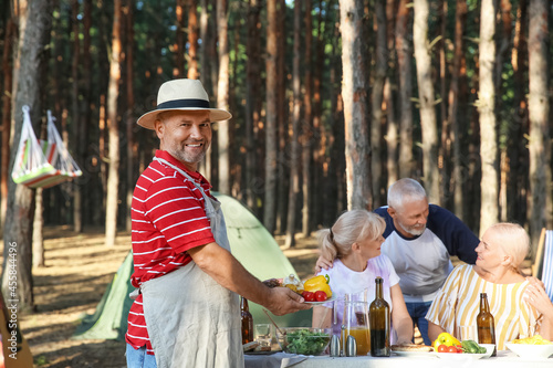 Mature people at barbecue p...