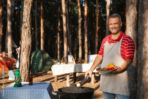 Mature man cooking food on ...