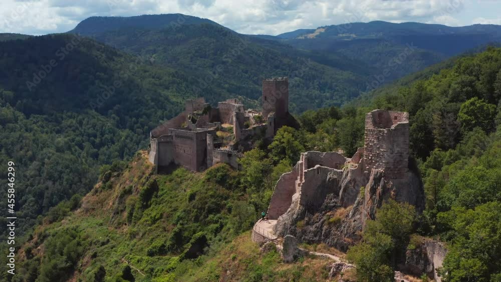 Approaching aerial shot of 2 medieval castles in the Alsace region of France. Approaching aerial shot of 2 medieval castles in the Alsace region of France.