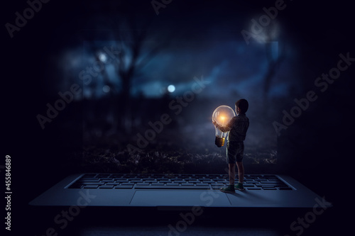 Boy with a glowing light bulb