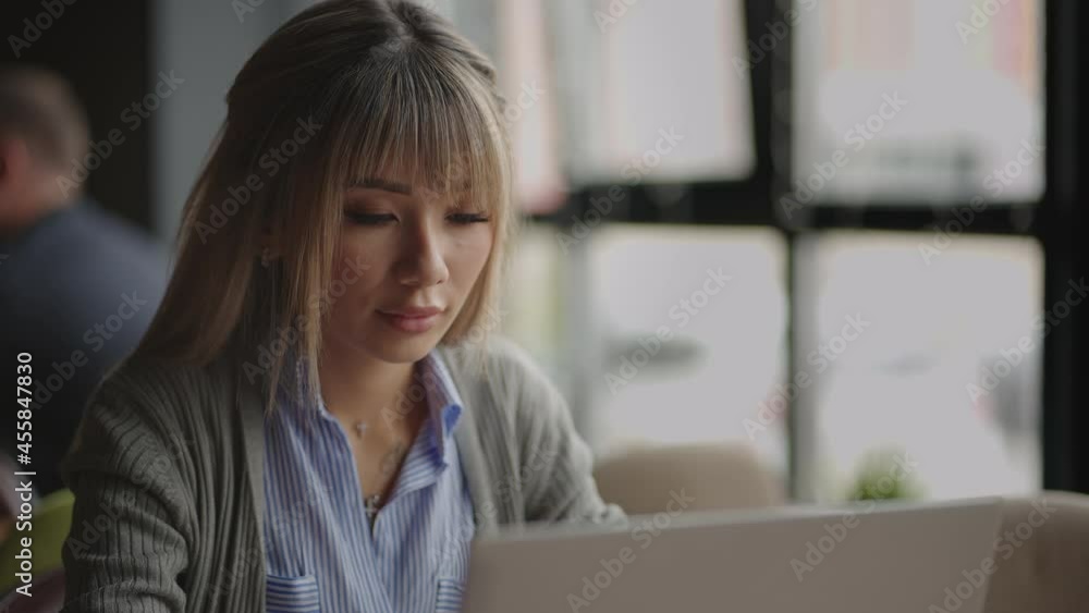 Thoughtful concerned chinese, japan, japanese, korean woman working on laptop computer looking away thinking solving problem, serious woman search for inspiration make decision feel lack of ideas Thoughtful concerned chinese, japan, japanese, korean woman working on laptop computer looking away thinking solving problem, serious woman search for inspiration make decision feel lack of ideas