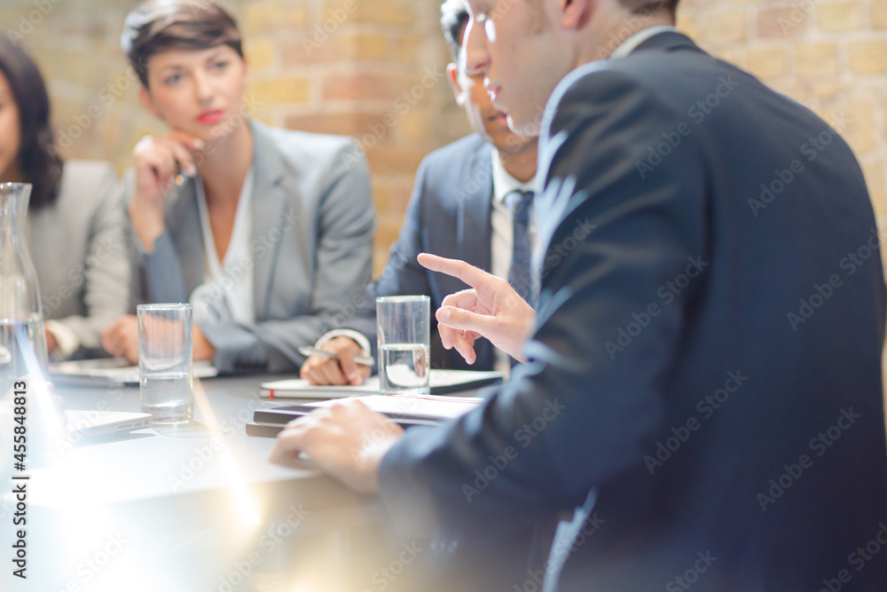 Business people talking in conference room Business people talking in conference room
