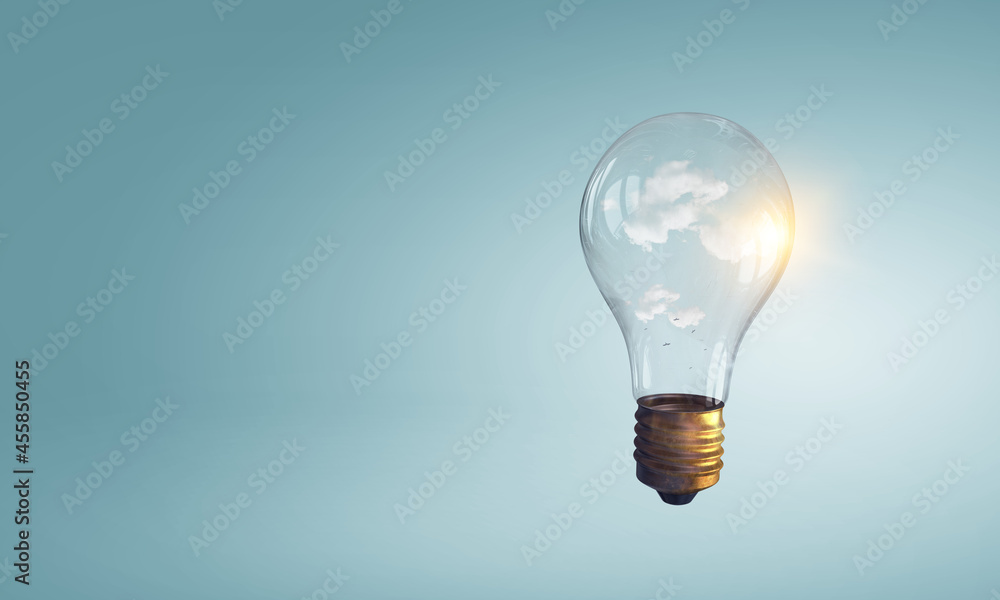 Light bulb on light blue background Light bulb on light blue background