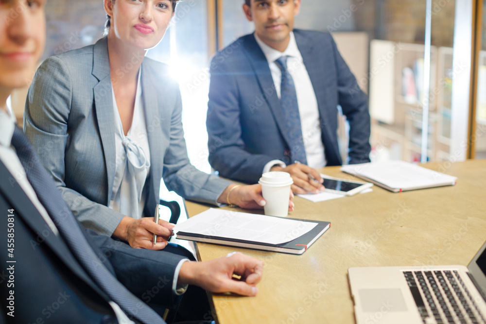 Business people talking at laptop in conference room Business people talking at laptop in conference room