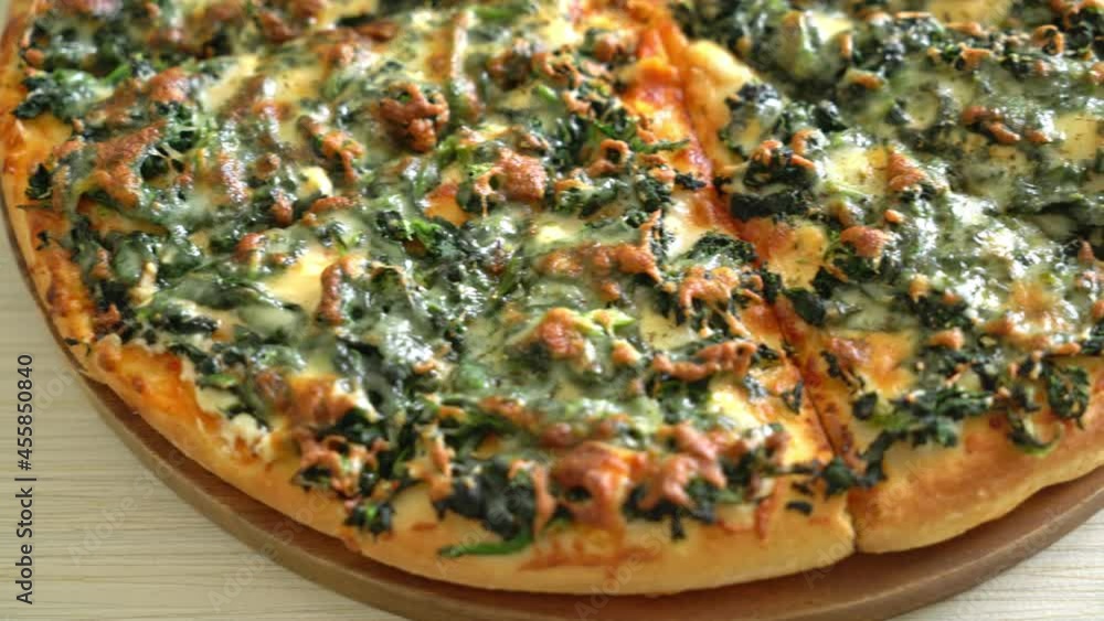 spinach and cheese pizza on wood tray - vegan and vegetarian food style spinach and cheese pizza on wood tray - vegan and vegetarian food style