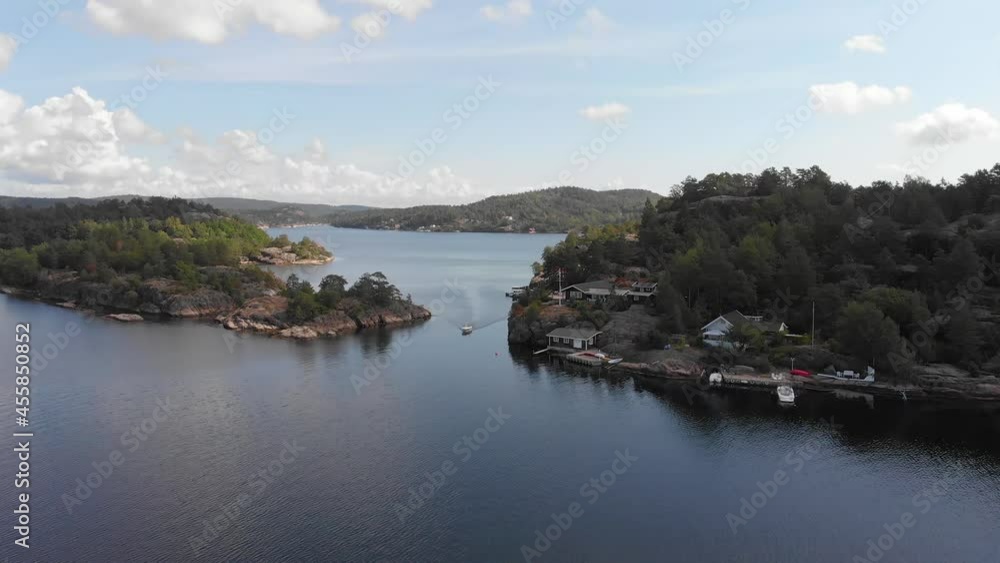 Idyllic location of summer cabins along fjord's coast, Scandinavia Idyllic location of summer cabins along fjord's coast, Scandinavia