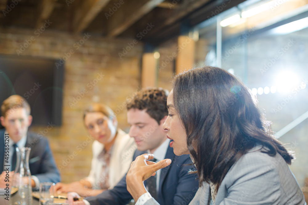 Business people talking in conference room Business people talking in conference room