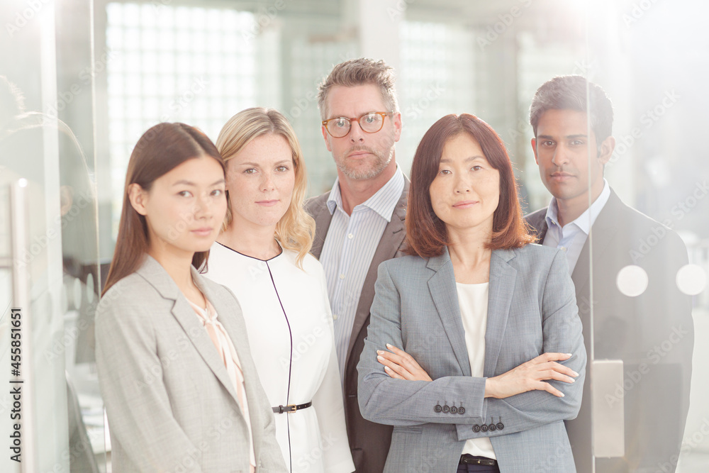 Portrait of confident business people in sunny office Portrait of confident business people in sunny office