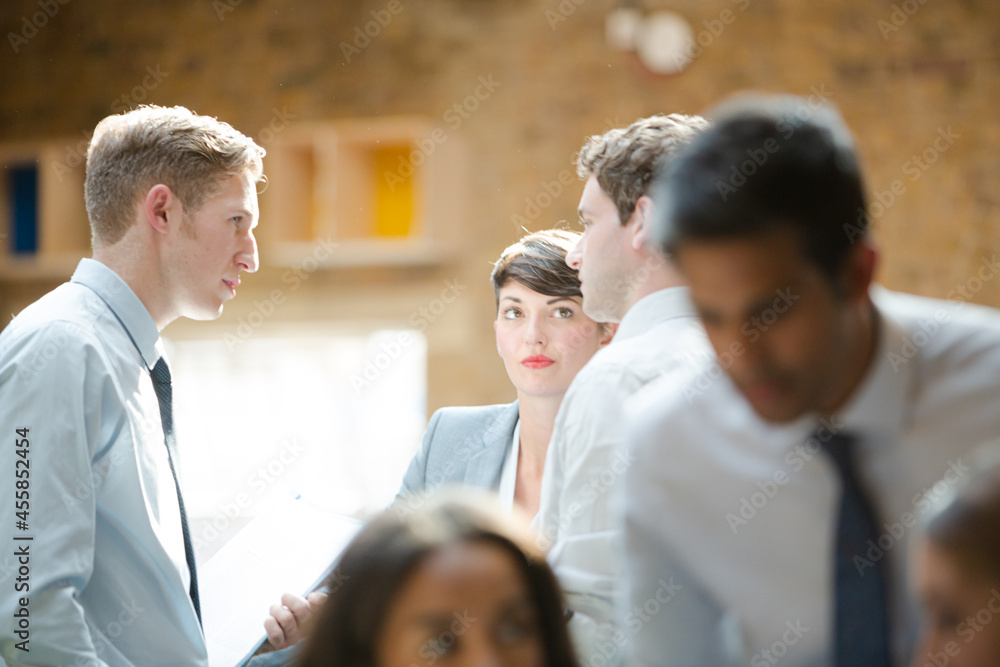Business people talking in conference room Business people talking in conference room