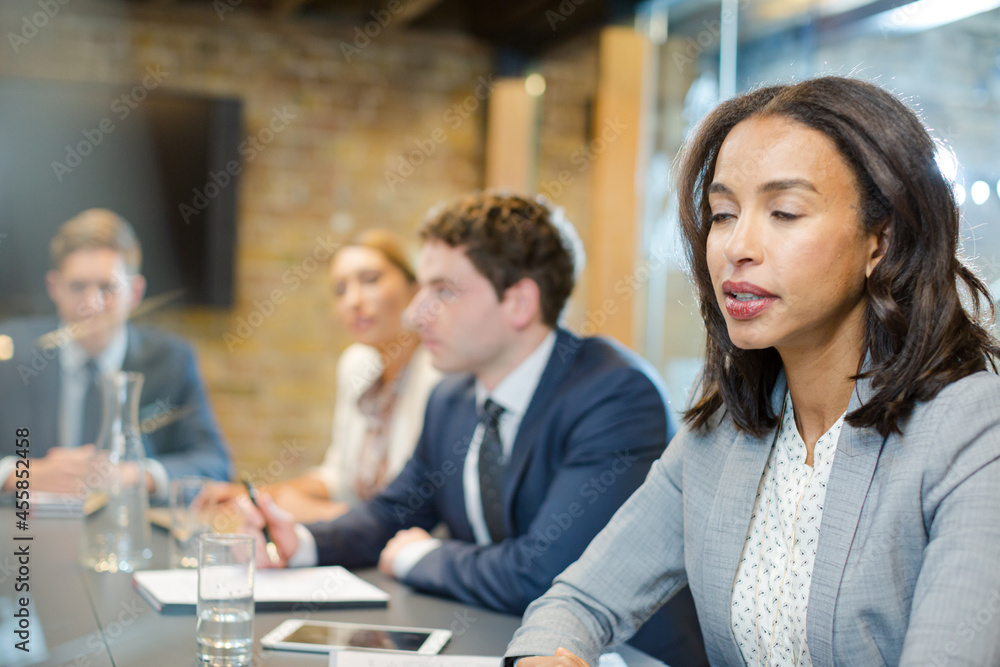 Business people talking in conference room Business people talking in conference room