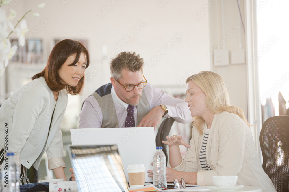 Fashion designers brainstorming in office Fashion designers brainstorming in office