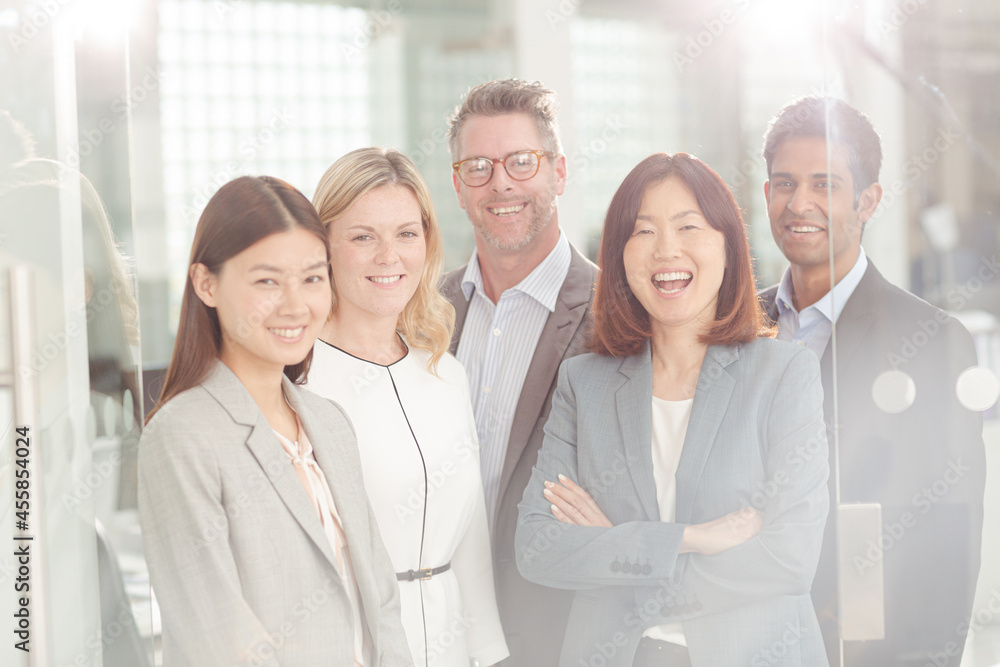 Portrait of confident business people in sunny office Portrait of confident business people in sunny office