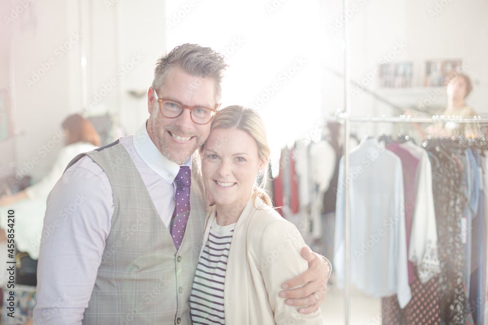 Portrait smiling fashion designers in office Portrait smiling fashion designers in office