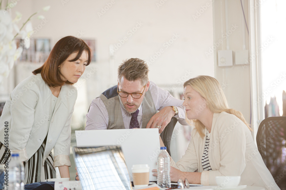 Fashion designers brainstorming in office Fashion designers brainstorming in office
