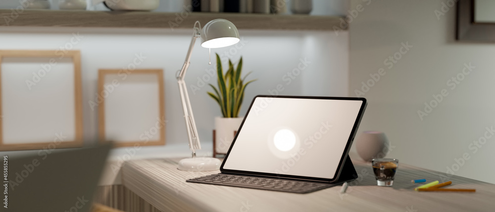 Fototapeta premium Modern home office interior with digital tablet mockup and keyboard on working desk