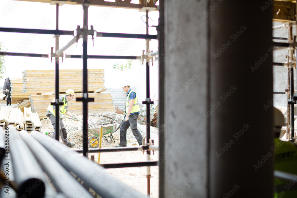 Construction workers at construction site Construction workers at construction site