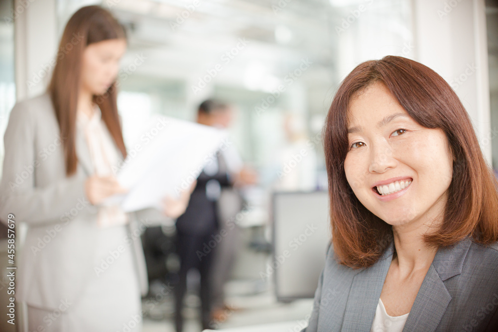 Portrait of smiling businesswoman in office Portrait of smiling businesswoman in office