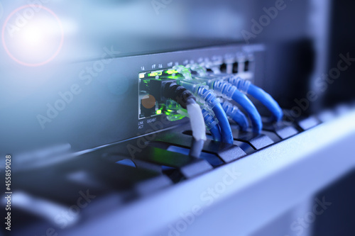 Quadro su tela Gigabit network switch for high speed network and high technology with UTP cat6 network cable and bokeh light effect