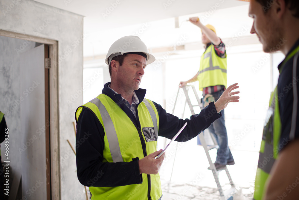 Foreman with digital tablet at construction site Foreman with digital tablet at construction site