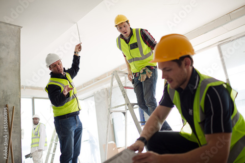 Construction worker with digital tablet at construction site