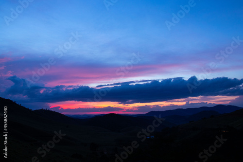 sunset, mountains, valleys, landscape, golden hour, orange sky.
blue and orange sky