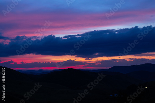 sunset, mountains, valleys, landscape, golden hour, orange sky.
blue and orange sky