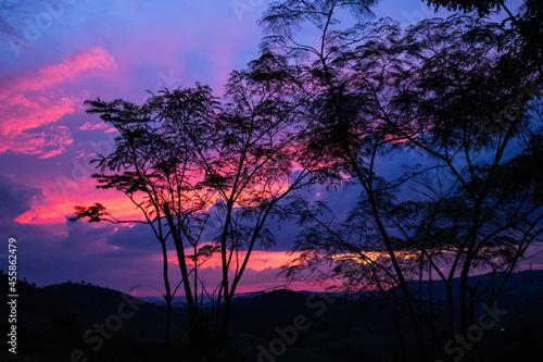 sunset, mountains, valleys, landscape, golden hour, orange sky.
blue and orange sky