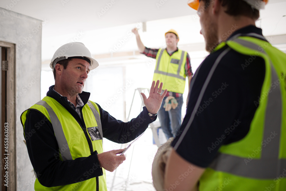 Foreman with digital tablet at construction site Foreman with digital tablet at construction site