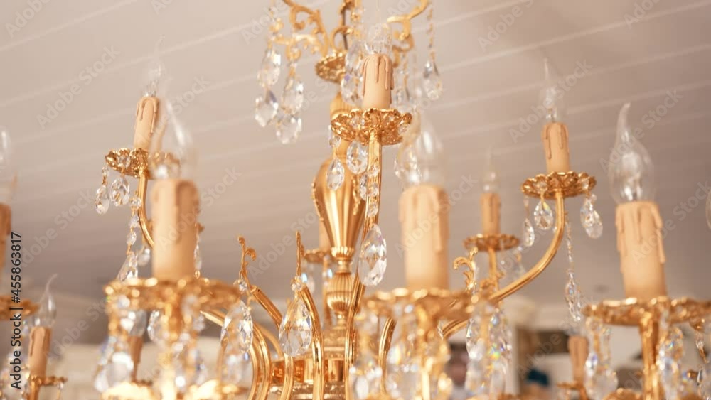 Rotating and ascending close up of candelabra crystal chandelier Rotating and ascending close up of candelabra crystal chandelier