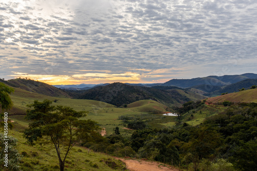 sunset, mountains, valleys, landscape, golden hour, orange sky.
blue and orange sky