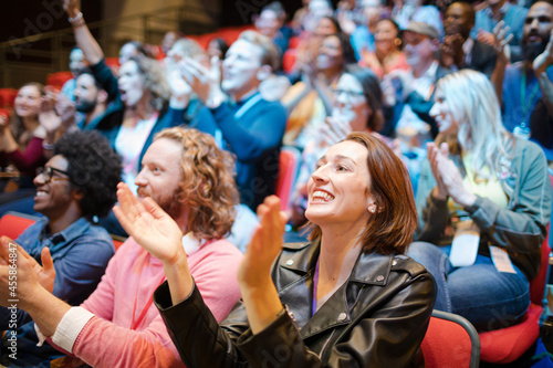 Smiling, excited audience cheering