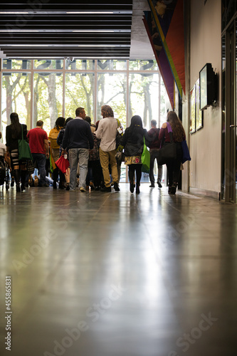 People talking in hall of auditorium